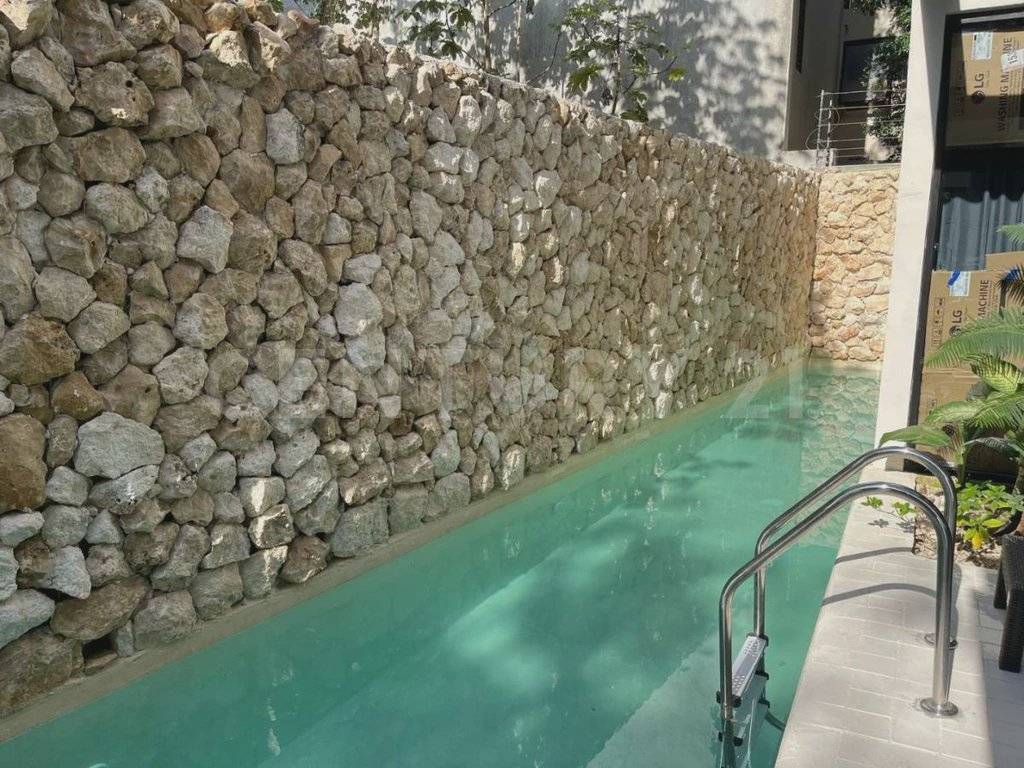 Moderno departamento en Tulum con balcón selva 2